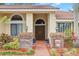 Inviting home entrance with brick accents and colorful landscaping at 3014 Ashland Ter, Clearwater, FL 33761