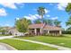Beautiful single-story home featuring a red tile roof and lush landscaping at 3014 Ashland Ter, Clearwater, FL 33761