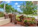 Attractive front yard featuring brick pillars and a variety of plants and greenery at 3014 Ashland Ter, Clearwater, FL 33761