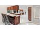 Modern kitchen featuring a breakfast bar, stainless steel appliances, and ample counter space at 3014 Ashland Ter, Clearwater, FL 33761