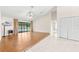 Spacious living room with tile and wood flooring and sliding doors to the pool at 3014 Ashland Ter, Clearwater, FL 33761