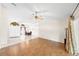 Spacious living area with tile flooring, arched doorways, and view into dining area, great for entertaining at 3014 Ashland Ter, Clearwater, FL 33761