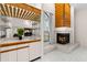The living room features a modern fireplace with unique wood detailing and a convenient wet bar at 3014 Ashland Ter, Clearwater, FL 33761