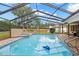 Screened-in pool and spa area, perfect for outdoor relaxation and entertainment at 3014 Ashland Ter, Clearwater, FL 33761