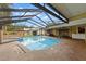 The screened-in pool and spa offer relaxation and enjoyment with a spacious deck and seating area at 3014 Ashland Ter, Clearwater, FL 33761