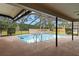 Enjoy the outdoors with this screened-in pool, perfect for swimming and entertaining with ample deck space at 3014 Ashland Ter, Clearwater, FL 33761
