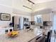 Modern kitchen with stainless steel appliances, granite counters, and island with seating at 3182 Windmoor N Dr, Palm Harbor, FL 34685