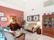 Cozy living room with beautiful decorations, comfortable seating, and bright natural light at 3182 Windmoor N Dr, Palm Harbor, FL 34685