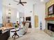 Bright living room featuring a stone fireplace and open floor plan at 3182 Windmoor N Dr, Palm Harbor, FL 34685