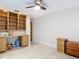 Office space with built in shelves, cabinets and an exterior door and tiled flooring at 3182 Windmoor N Dr, Palm Harbor, FL 34685