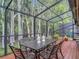 Enclosed patio with seating to enjoy outdoor living at 3182 Windmoor N Dr, Palm Harbor, FL 34685