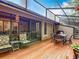 Screened patio with table and chairs to enjoy outdoor living at 3182 Windmoor N Dr, Palm Harbor, FL 34685