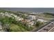 Aerial view showcases community near the bay, highway access, and lush trees at 343 S Mcmullen Booth Rd # 151, Clearwater, FL 33759