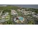 Aerial view shows community pool, condos, parking, and landscaping at 343 S Mcmullen Booth Rd # 151, Clearwater, FL 33759