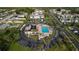Aerial view showcases community pool area, ample parking, and landscaping at 343 S Mcmullen Booth Rd # 151, Clearwater, FL 33759