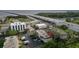 Aerial shot of complex with trees, parking, and bay in the background at 343 S Mcmullen Booth Rd # 151, Clearwater, FL 33759