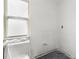 Bathroom with a window and covered fixtures, ready for renovation at 343 S Mcmullen Booth Rd # 151, Clearwater, FL 33759