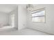 Unfinished bedroom features a window and doorway ready for customization at 343 S Mcmullen Booth Rd # 151, Clearwater, FL 33759