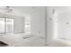 Unfinished living room featuring sliding door, light-filled space ready for design at 343 S Mcmullen Booth Rd # 151, Clearwater, FL 33759
