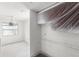 View of a room being painted, with coverings on the light fixture and cabinet at 343 S Mcmullen Booth Rd # 151, Clearwater, FL 33759