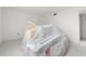 A view of a room with items covered and ready for paint at 343 S Mcmullen Booth Rd # 151, Clearwater, FL 33759