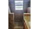 Tiled shower with granite seat and stained glass window at 3607 N 13Th St, Tampa, FL 33605