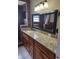 Updated bathroom with granite counters, modern fixtures, and tiled shower at 3607 N 13Th St, Tampa, FL 33605