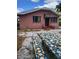 Charming brick home with mosaic table and benches in the yard at 3607 N 13Th St, Tampa, FL 33605