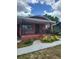 Charming single-story brick home with a covered front porch and decorative iron railings at 3607 N 13Th St, Tampa, FL 33605