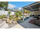 Landscaped backyard featuring a rock waterfall, patio seating and a covered lanai, perfect for relaxation and entertaining at 37673 Dixie Ave, Dade City, FL 33525