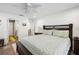 A large bedroom with a connected bathroom, wood-look floors and lots of light at 37673 Dixie Ave, Dade City, FL 33525