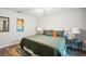 Stylish bedroom with wood-look flooring, large window, and eye-catching decor accents at 37673 Dixie Ave, Dade City, FL 33525