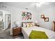 Comfortable bedroom with wood-look floors, white walls, side tables, and closet at 37673 Dixie Ave, Dade City, FL 33525