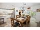 Dining area featuring a wooden table and chairs with an elegant chandelier at 37673 Dixie Ave, Dade City, FL 33525