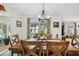 Spacious dining room features a wooden table and chairs with natural light at 37673 Dixie Ave, Dade City, FL 33525