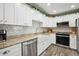 Stylish kitchen with modern appliances, granite countertops, and tiled backsplash at 37673 Dixie Ave, Dade City, FL 33525