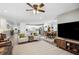 Open-concept living area flows into a modern kitchen and dining area at 37673 Dixie Ave, Dade City, FL 33525