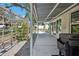 Extended covered patio with a pergola, adjacent to a landscaped yard with pavers leading to outdoor seating at 37673 Dixie Ave, Dade City, FL 33525
