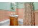 Retro bathroom featuring colorful tiles and updated fixtures at 4105 W Bay Villa Ave, Tampa, FL 33611