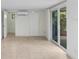 Neutral room with tile floor, sliding doors, and ample natural light at 4105 W Bay Villa Ave, Tampa, FL 33611