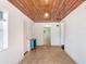 A versatile room with a wooden ceiling and light tile flooring at 4105 W Bay Villa Ave, Tampa, FL 33611