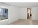 Open room with tile flooring and sliding doors leading to the outside at 4105 W Bay Villa Ave, Tampa, FL 33611