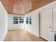 Bright room featuring a wood plank ceiling and two large windows at 4105 W Bay Villa Ave, Tampa, FL 33611