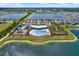 Community clubhouse and pool with playground and tennis courts, all nestled by a serene lake at 414 Sunlit Coral St, Ruskin, FL 33570