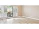 A bright bedroom with large window, shutters, and modern vinyl flooring at 4230 Hartwood Ln, Tampa, FL 33618