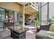 Private patio area with wicker furniture, decor, and a bright, open atmosphere at 4230 Hartwood Ln, Tampa, FL 33618