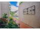 Landscaped walkway with red brick pavers leading to the entrance of this townhome at 4230 Hartwood Ln, Tampa, FL 33618