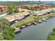 Aerial view of waterfront condos with boat docks and serene water views, highlighting the community's location at 4306 Sunray Ct, Tampa, FL 33615
