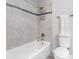 A tiled bathtub and shower combination with a decorative tile accent creates an appealing bathing space at 4306 Sunray Ct, Tampa, FL 33615