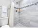 Modern bathroom shower featuring sleek tiling, modern fixtures, and a clean, updated design at 4306 Sunray Ct, Tampa, FL 33615